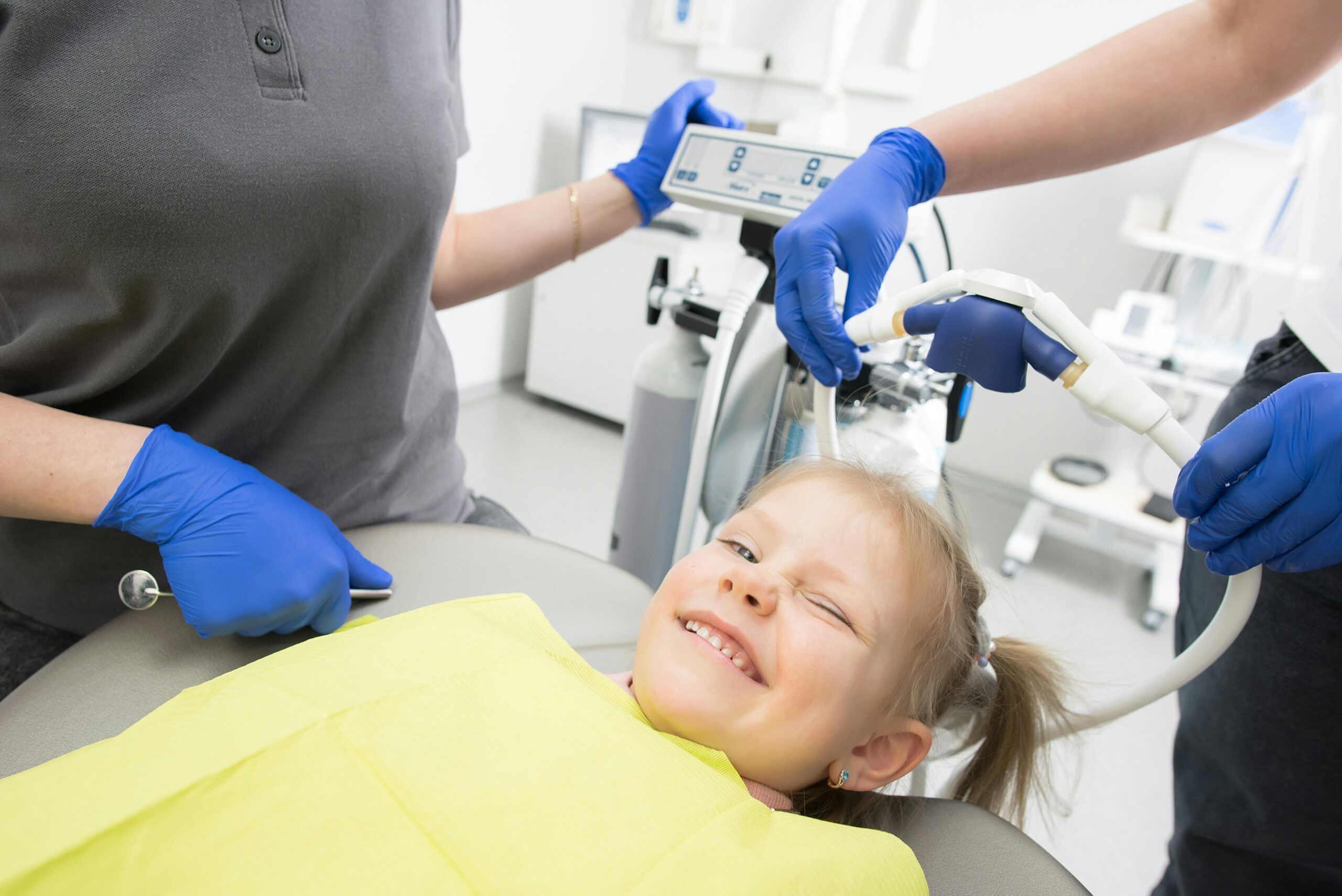 Happy child getting dental work.